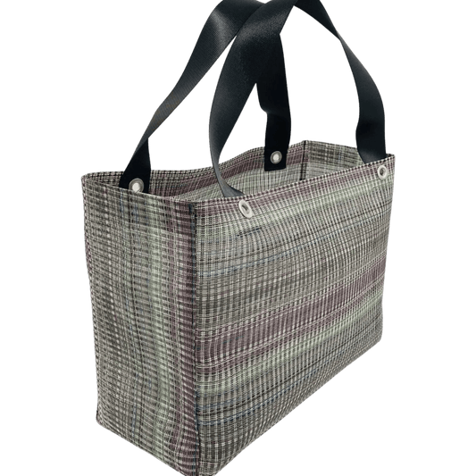Upcycled, sturdy purple tote bag against a white background.